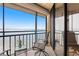 Balcony with seating overlooking serene waterfront views at 5633 Puerta Del Sol S Blvd # 306, St Petersburg, FL 33715