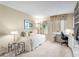 Cozy bedroom with a daybed, mirrored closet, and a desk by the window, offering a comfortable and functional space at 5633 Puerta Del Sol S Blvd # 306, St Petersburg, FL 33715