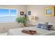 Bright bedroom featuring water views, neutral walls, and comfortable furnishings at 5633 Puerta Del Sol S Blvd # 306, St Petersburg, FL 33715