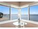 Inviting breakfast nook featuring floor to ceiling windows with breathtaking waterfront views at 5633 Puerta Del Sol S Blvd # 306, St Petersburg, FL 33715