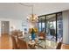 Light and airy dining room with glass table and sliders leading to a private screened balcony at 5633 Puerta Del Sol S Blvd # 306, St Petersburg, FL 33715