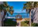 Scenic gazebo nestled between palm trees, offering a tranquil space with serene views of the water at 5633 Puerta Del Sol S Blvd # 306, St Petersburg, FL 33715