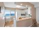 Modern kitchen with granite countertops and a cozy breakfast nook with stunning water views at 5633 Puerta Del Sol S Blvd # 306, St Petersburg, FL 33715