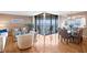 Bright living room with water views, stylish furniture, and dining area at 5633 Puerta Del Sol S Blvd # 306, St Petersburg, FL 33715
