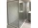 Walk in shower featuring a large shower head with a tile surround and a glass enclosure at 6035 Plover Meadow St, Lithia, FL 33547