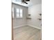 Bedroom with bright, natural light, ceiling fan, and decorative wood shelving at 6035 Plover Meadow St, Lithia, FL 33547
