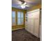 Cozy bedroom with built in murphy bed and closet system, as well as plantation shutters at 6035 Plover Meadow St, Lithia, FL 33547
