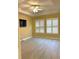Bright bedroom with hardwood floors and plantation shutters at 6035 Plover Meadow St, Lithia, FL 33547