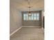 Elegant dining room with hardwood floors and a chandelier at 6035 Plover Meadow St, Lithia, FL 33547