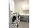 Laundry room with washer, dryer, and cabinets at 6035 Plover Meadow St, Lithia, FL 33547