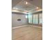 Spacious living room featuring hardwood floors and plantation shutters at 6035 Plover Meadow St, Lithia, FL 33547