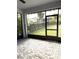 Spacious screened porch with paver flooring at 6035 Plover Meadow St, Lithia, FL 33547