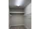 Bright walk-in closet with shelves, hanging rods, and ample storage space at 6035 Plover Meadow St, Lithia, FL 33547