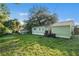 Large backyard with grassy lawn and shed at 7202 N 21St St, Tampa, FL 33610