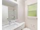 Bathroom features a vanity, shower, and toilet at 7202 N 21St St, Tampa, FL 33610