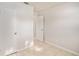 Bright bedroom featuring tile floors and an adjacent bathroom at 7202 N 21St St, Tampa, FL 33610