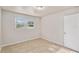 Bright bedroom with tile floors and two windows at 7202 N 21St St, Tampa, FL 33610
