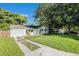 Newly renovated house with a long driveway at 7202 N 21St St, Tampa, FL 33610