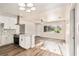 Modern kitchen with white cabinets and a breakfast bar at 7202 N 21St St, Tampa, FL 33610