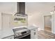 Modern kitchen features stainless steel appliances and a large island at 7202 N 21St St, Tampa, FL 33610