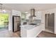 Modern kitchen with white cabinets and stainless steel appliances at 7202 N 21St St, Tampa, FL 33610