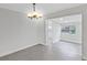 Bright dining room with tile floors and chandelier at 806 Chadsworth Ave, Seffner, FL 33584