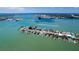 Wide aerial showcasing waterfront homes, boaters paradise at 817 Bay Point Dr, Madeira Beach, FL 33708