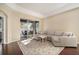 Bright living room showcasing an area rug and slider doors leading to the outdoor patio at 8317 Moccasin Trail Dr, Riverview, FL 33578