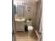 Clean bathroom with a toilet, sink, and shower at 8615 Mallard Reserve Dr # 102, Tampa, FL 33614
