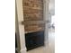 Stone fireplace with a mantel and white columns at 8615 Mallard Reserve Dr # 102, Tampa, FL 33614