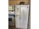 Kitchen with white appliances and wood cabinets at 8615 Mallard Reserve Dr # 102, Tampa, FL 33614