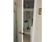Small laundry closet with washer and shelving at 8615 Mallard Reserve Dr # 102, Tampa, FL 33614