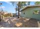 Large backyard with wooden fence and mature trees at 931 And 925 Florida Ave, Palm Harbor, FL 34683