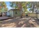 Large backyard with a wooden fence and mature trees at 931 And 925 Florida Ave, Palm Harbor, FL 34683