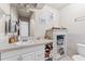 Bathroom with vanity, toilet, and built-in shelving at 931 And 925 Florida Ave, Palm Harbor, FL 34683
