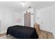 Spacious bedroom with a massage table and hardwood floors at 931 And 925 Florida Ave, Palm Harbor, FL 34683