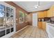 Bright kitchen with door leading to backyard at 931 And 925 Florida Ave, Palm Harbor, FL 34683