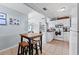 Bright kitchen with white cabinets, tile floor, and breakfast bar at 931 And 925 Florida Ave, Palm Harbor, FL 34683