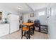 Kitchen features white appliances, wood table, and light blue walls at 931 And 925 Florida Ave, Palm Harbor, FL 34683