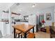 Bright kitchen with white cabinets and a small dining area at 931 And 925 Florida Ave, Palm Harbor, FL 34683