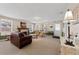 Spacious living room featuring a fireplace and comfortable leather seating at 931 And 925 Florida Ave, Palm Harbor, FL 34683