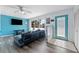 Living area with light blue walls, hardwood floors, and a comfy sofa at 931 And 925 Florida Ave, Palm Harbor, FL 34683
