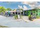 Coolside gelato bar with outdoor seating and plants at 931 And 925 Florida Ave, Palm Harbor, FL 34683