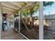 Screened-in patio area with wooden flooring and backyard access at 931 And 925 Florida Ave, Palm Harbor, FL 34683