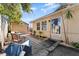 Inviting side yard entry with patio and landscaping at 931 And 925 Florida Ave, Palm Harbor, FL 34683