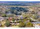 Aerial view highlighting a house with a backyard in a community at 947 Sousa Dr, Largo, FL 33771