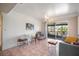 Bright living room featuring stylish furniture and sliding doors that lead to a screened balcony at 1003 S Bayshore Blvd # 206, Safety Harbor, FL 34695