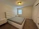 Bright bedroom featuring a comfortable bed and ample closet space at 107 S Obrien St # 220, Tampa, FL 33609
