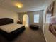 Spacious bedroom with a large bed and neutral decor at 107 S Obrien St # 220, Tampa, FL 33609