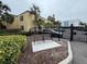 Condo building with a gated entrance and seating area at 107 S Obrien St # 220, Tampa, FL 33609